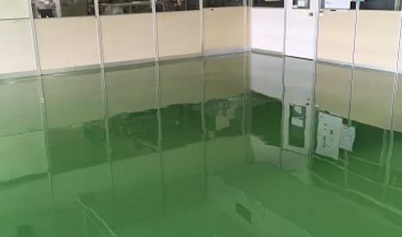 油が染みた工場床のイメージ